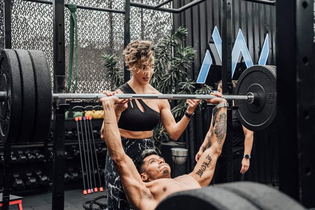 Photo by Mike González A Man Lifting Weights