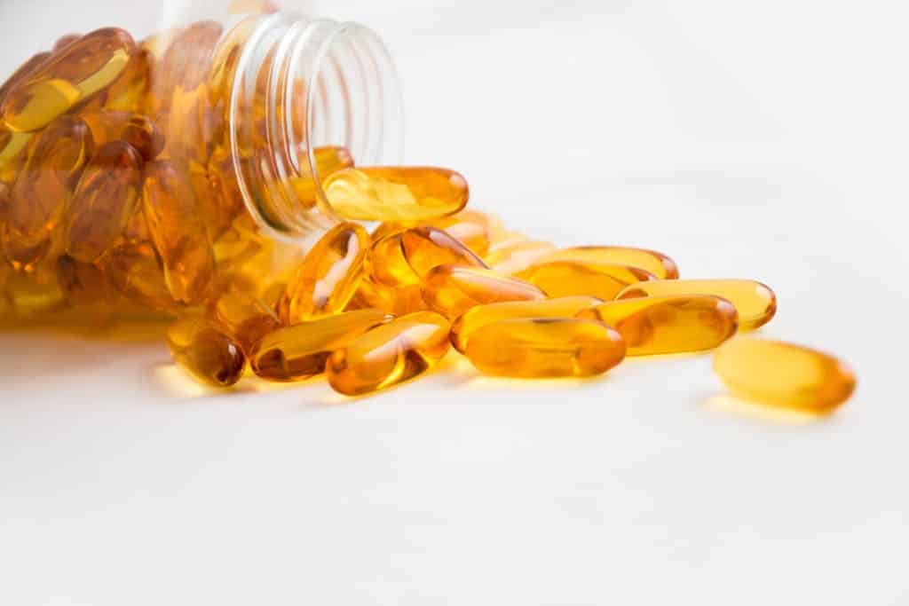 Photo by Pixabay Spilled Bottle of Yellow Capsule Pills