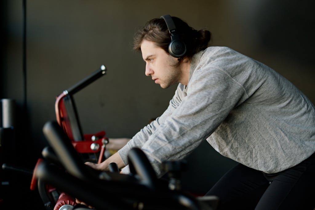 Tabata Ride: A High-Intensity Workout for Maximum Results Man in Gray Sweater Exercising