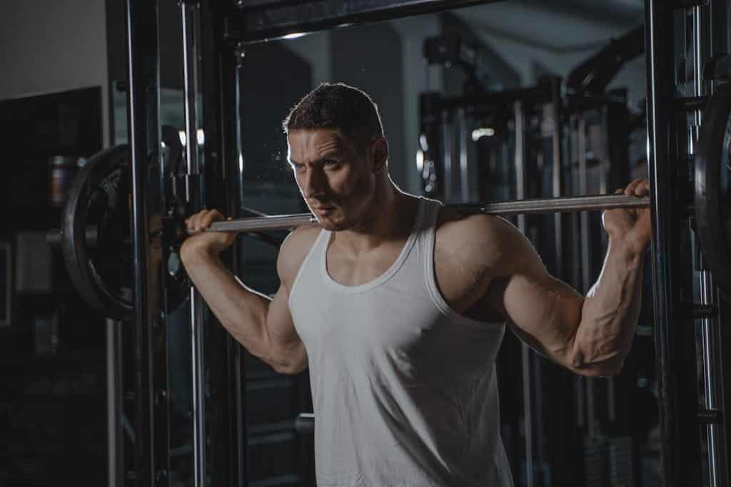 Photo by Tima Miroshnichenko A Man Lifting a Barbell