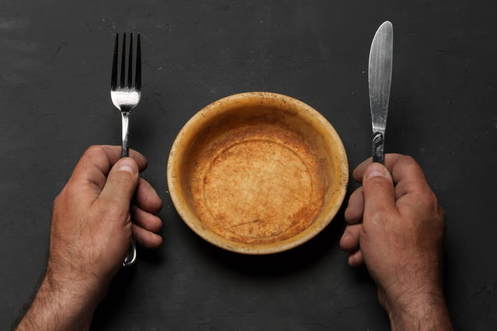 Empty bowl on dark background with copy space