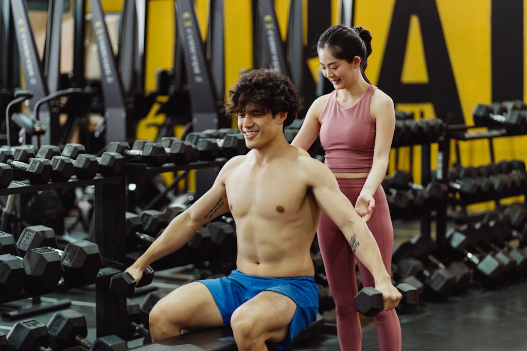 Photo by Ketut Subiyanto A Man and a Woman at a Gym