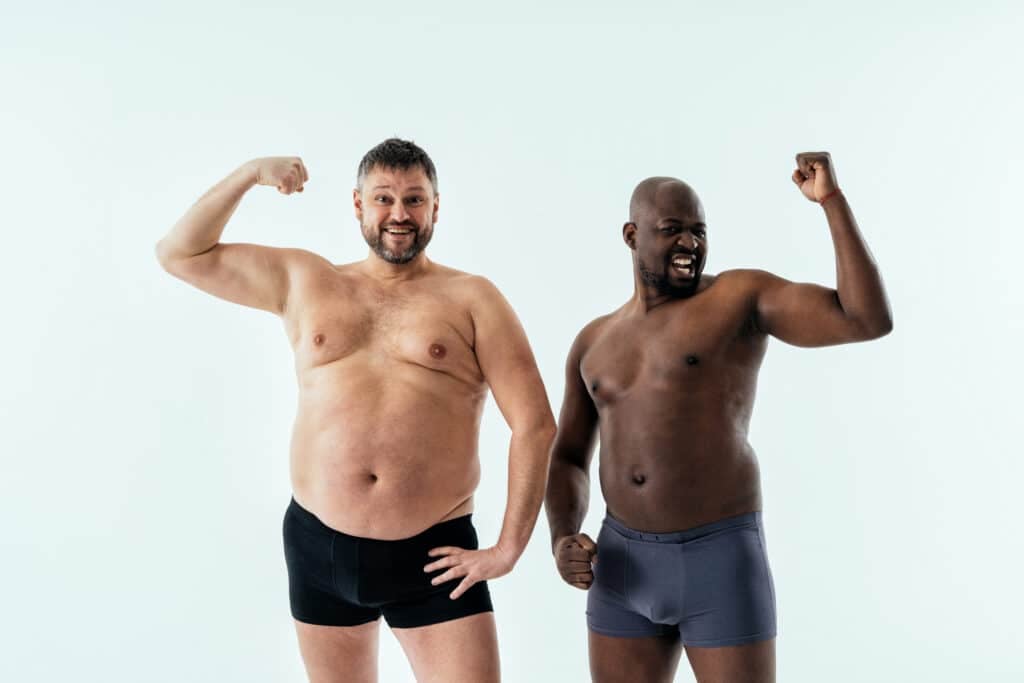 two multiethnic men posing for a male edition body positive beau two multiethnic men posing for a male edition body positive beau