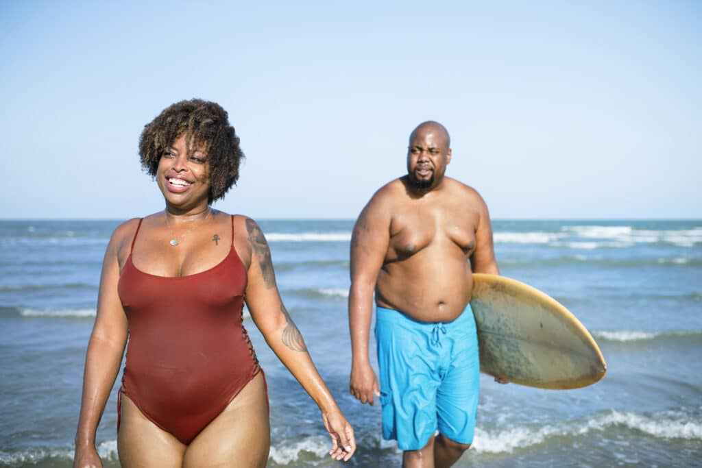 Happy couple playing in the sea Happy couple playing in the sea