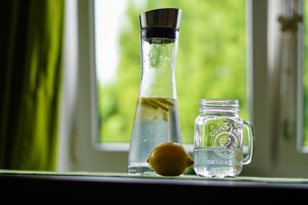 Photo by Pixabay Shallow Focus Photography of Yellow Lemon Near Glass Mason Jar and Glass Decanter