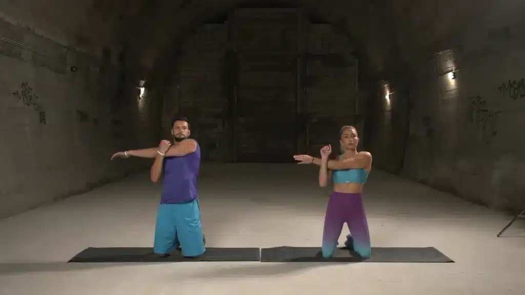 Shoulder Stretch Ext 0-2 screenshot man and woman doing a shoulder stretch