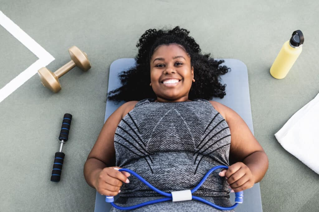 Portrait of curvy woman doing workout routine outdoor at city pa Portrait of curvy woman doing workout routine outdoor at city pa