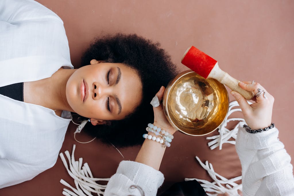 Girl in White Long Sleeve Shirt Holding Gold Round Container