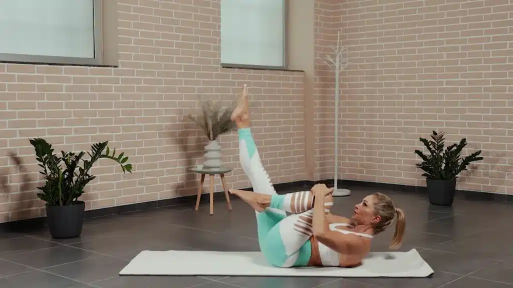 single leg stretch pilates pose