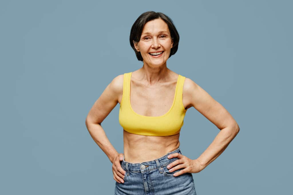a woman in a yellow tank top