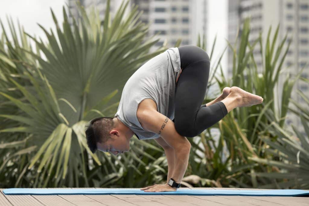 man-practicing-yoga-position-outside-1