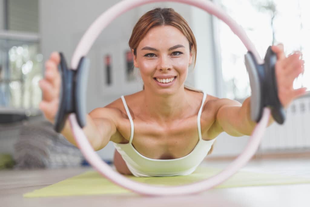 happy woman doing pilates