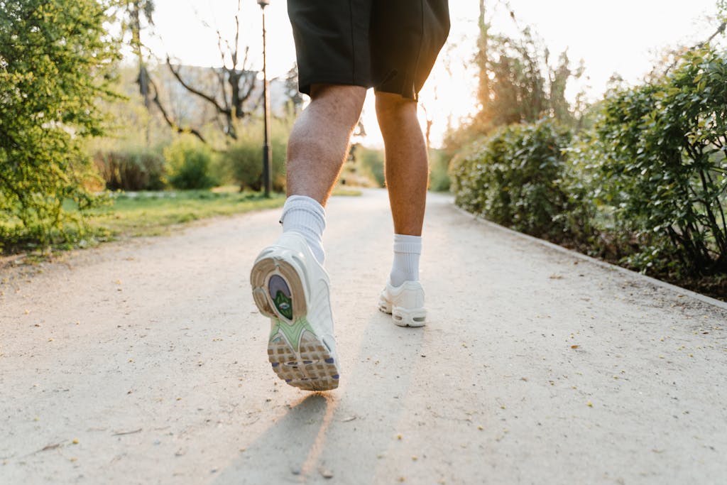 A Person in White Rubber Shoes Running