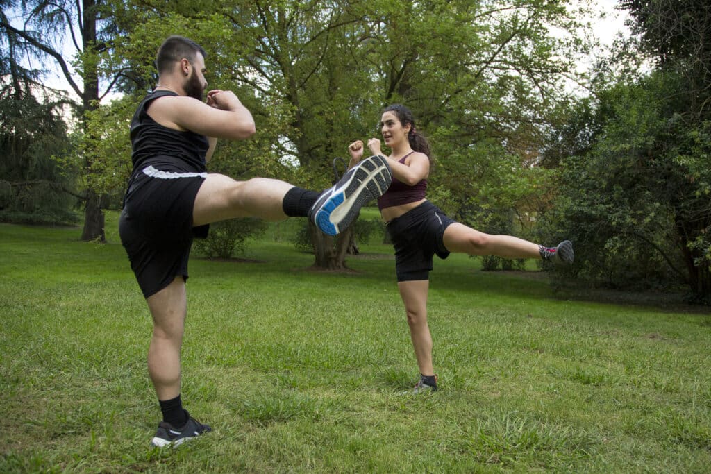 young man and woman caucasian couple practicing sport outdoor