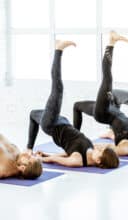 People practising yoga in the studio