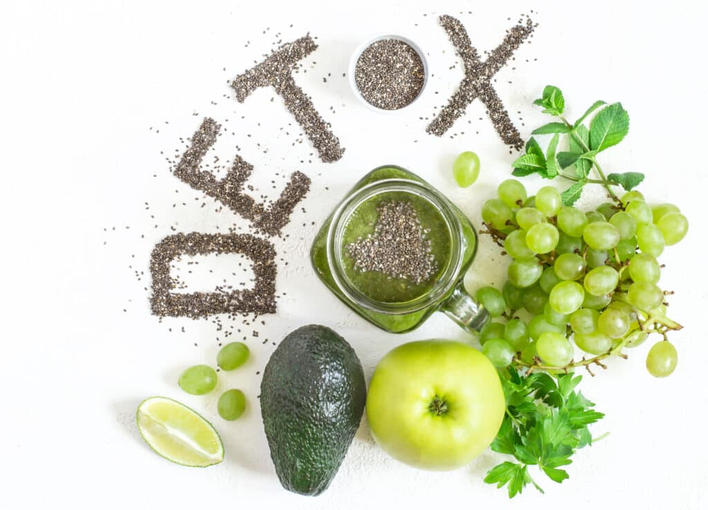 Word detox is made from chia seeds. Green smoothies and ingredients. Concept of diet, cleansing the body, healthy eating