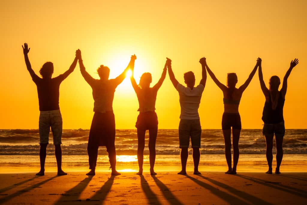 six health people in stand hatha position with hand up raced and