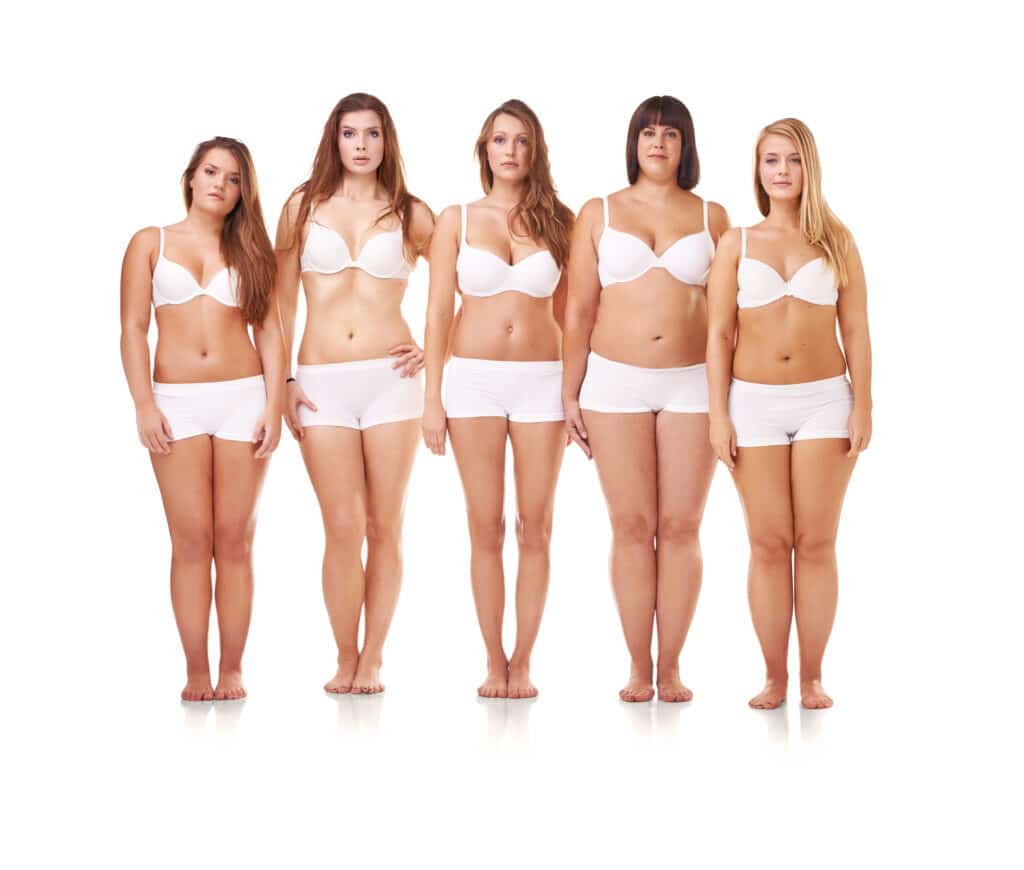 Full-length portrait of a confident young woman posing in her underwear. Full-length portrait of a confident young woman posing in her underwear.