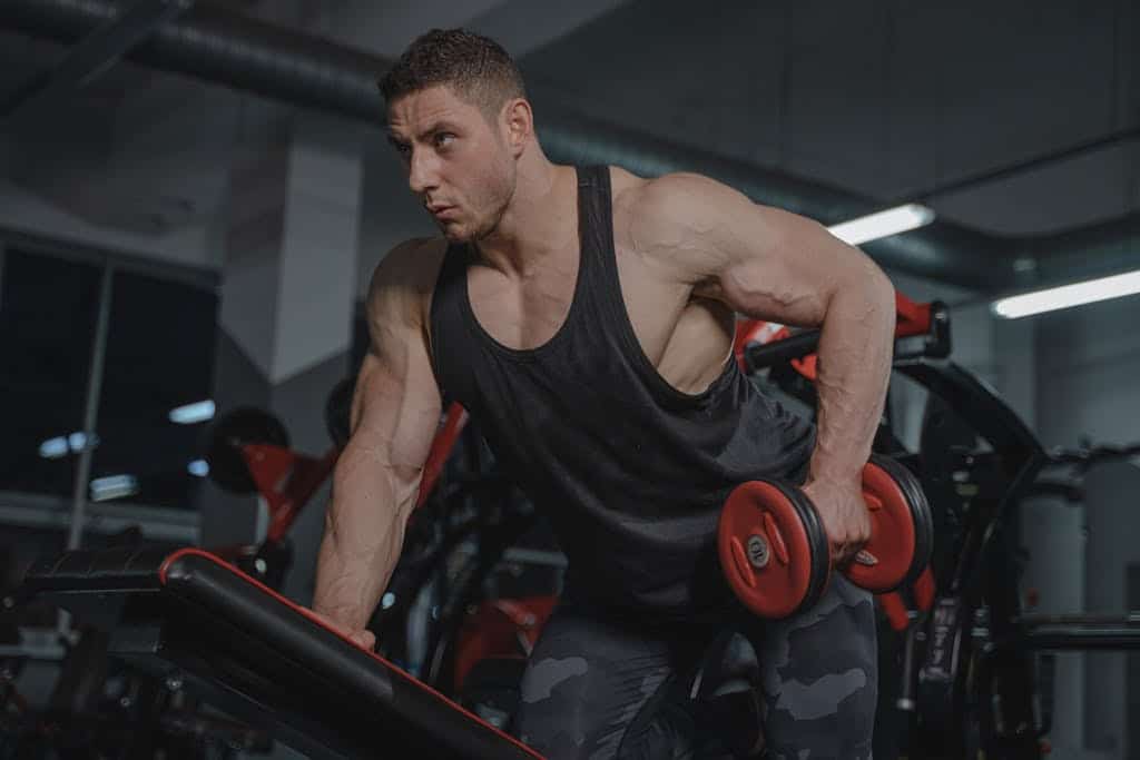 Photo by Tima Miroshnichenko A Man Lifting a Dumbbell