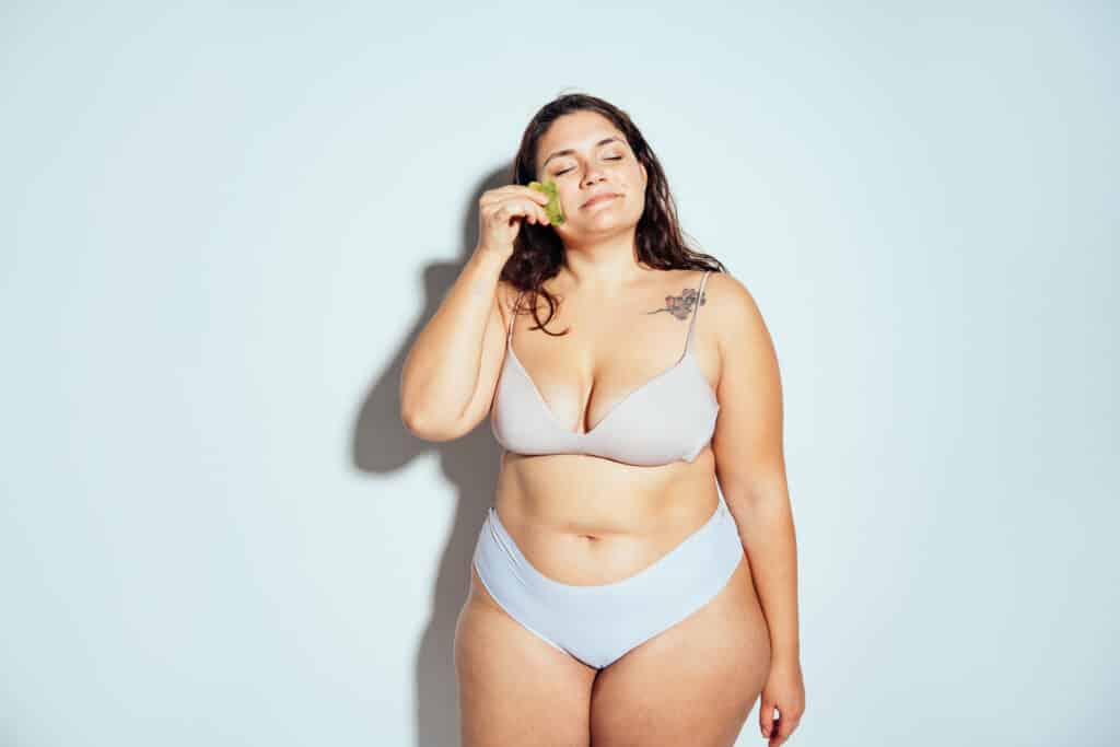 Plus size woman posing in studio in lingerie Plus size woman posing in studio in lingerie
