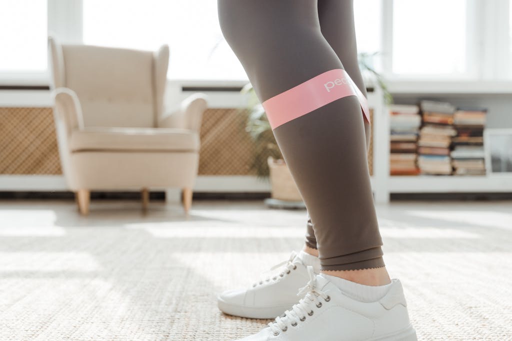 What to Wear to Pilates: A Complete Guide Person Wearing Gray Legging using Resistance Band