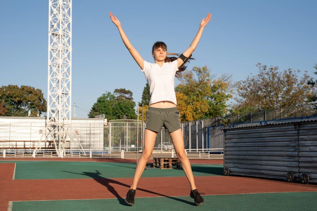 young-sports-girl-jumping-on-the-stadium-and-risin-2023-11-27-05-30-01-utc