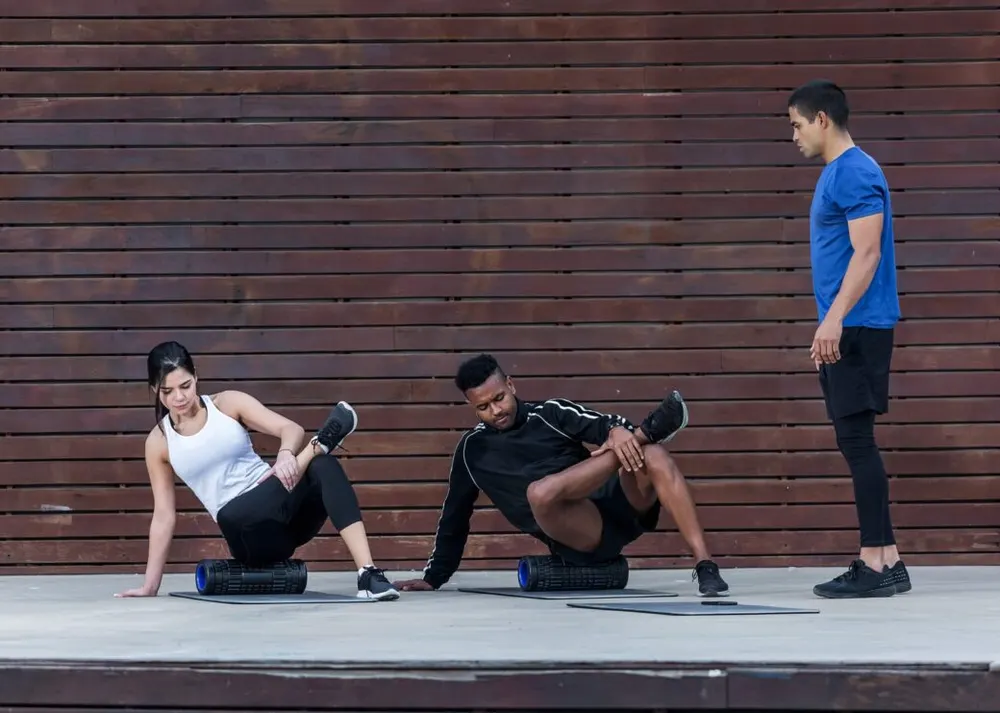 Trainer guiding athletes through a session